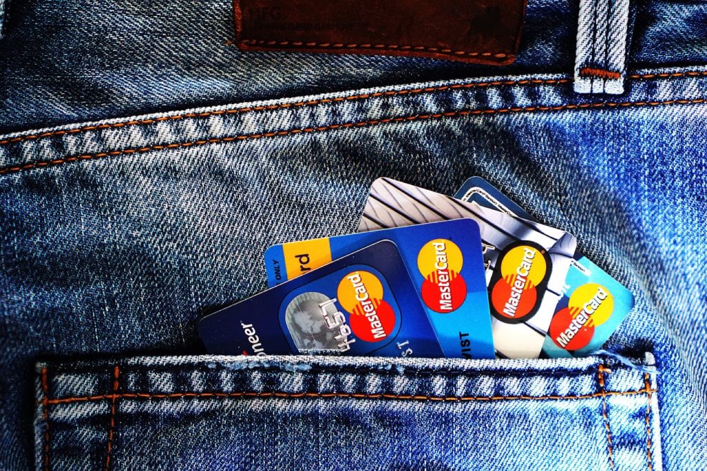 A small stack of credit and debit cards.